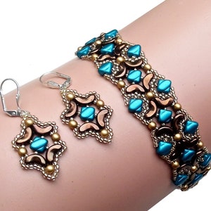 May include: A teal and gold beaded bracelet and matching earrings. The bracelet is made with small, faceted beads in a geometric pattern. The earrings are dangle earrings with a similar design.