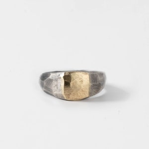 Unique wide ring for men and women in oxidized silver and 14K solid yellow gold on top.