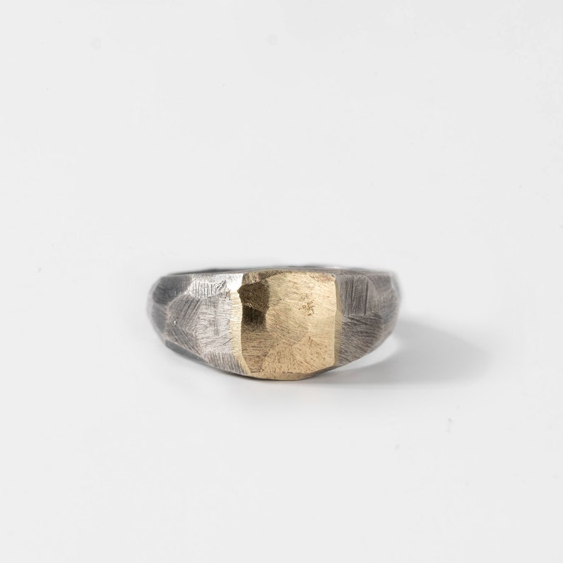 Unique wide ring for men and women in oxidized silver and 14K solid yellow gold on top.