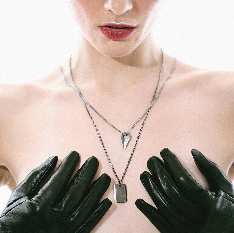Unisex sterling silver arrow necklace in brutalist style, meticulously handmade with an oxidized silver look.