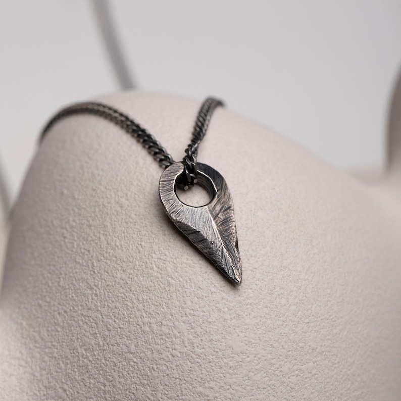 Handcrafted sterling silver arrow necklace in brutalist design, oxidized for a unique and rugged appearance, suitable for men and women