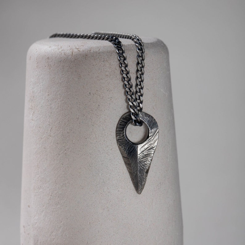 Handmade brutalist sterling silver arrow necklace, designed for men and women with an oxidized silver finish