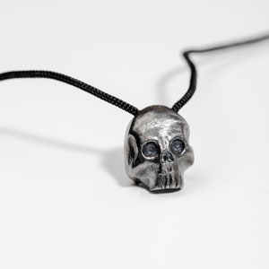 Closer look of the skull pendant, where all details are more obvious, the eyes, nose, teeth. The pendant is completely made by hand in oxidized sterling silver 925.