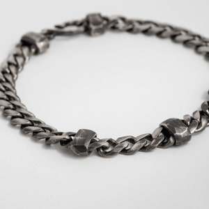 Closer look of the handmade faceted links on the chain bracelet. The metal is oxidized sterling silver
