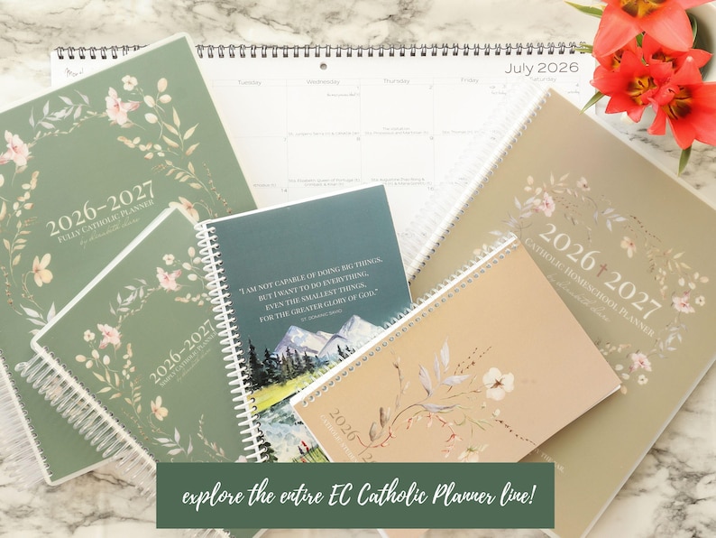 May include: An assortment of 2026-2027 Catholic planners and a calendar, in various sizes and colors, with floral designs. The planners are in shades of green and beige, with spiral binding. The text "explore the entire EC Catholic Planner line!" is visible.