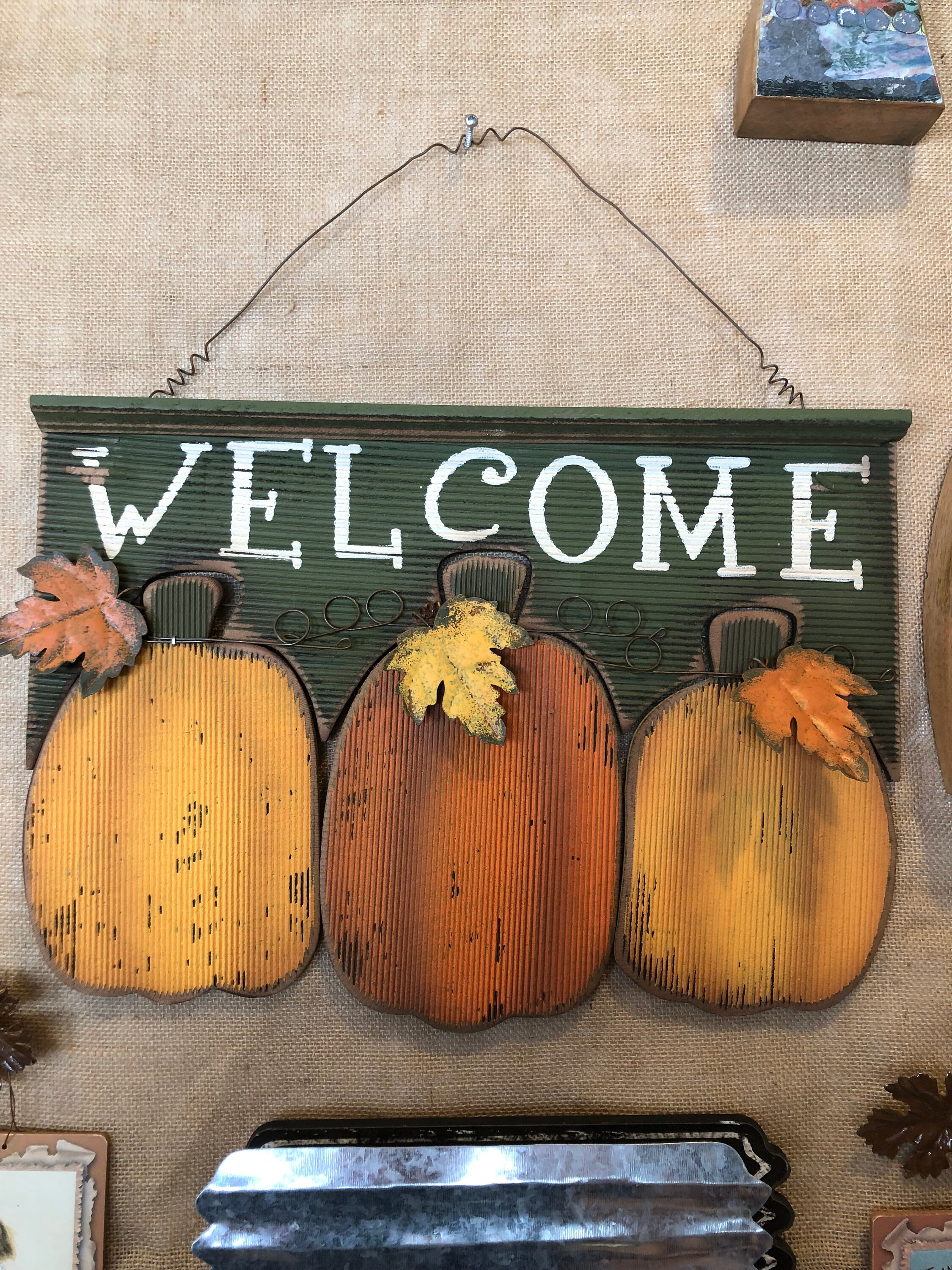 Fall harvest pumpkin welcome sign with metal leaf details wire hangers
