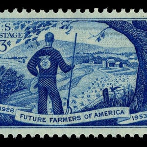 May include: A blue postage stamp featuring a farmer standing in a field, holding a pitchfork, with a rural landscape in the background. The stamp reads "U.S. Postage 3¢" and "Future Farmers of America" with the years 1928 and 1953.