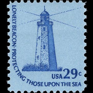 May include: A blue and white postage stamp with a lighthouse illustration and the text "Lonely Beacon - Protecting Those Upon The Sea" and "USA 29c".