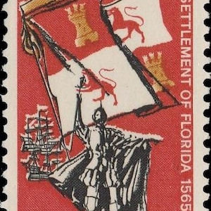 May include: A red United States postage stamp with a 5 cent denomination. The stamp depicts a man holding a flag with a castle and lion, a ship, and the text "Settlement of Florida 1565-1965".
