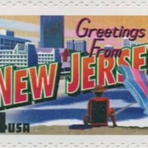 May include: A vintage-style postcard featuring a colourful illustration of a beach scene with buildings in the background. The text "Greetings from NEW JERSEY" is in a bold, stylised font. The postcard is a 34-cent stamp with the year 2002 printed in the bottom left corner.