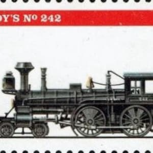 Puede incluir: Una locomotora de vapor negra y plateada con el texto "EDDY'S No 242" y "1874 USA 29" en un sello rojo y blanco.