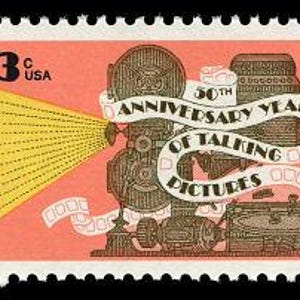May include: A 13-cent US postage stamp commemorating the 50th anniversary of talking pictures. The stamp features a black and white illustration of a film projector with a reel of film and a record player.