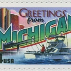 May include: A postage stamp with the words "Greetings from Michigan" and a boat on water. The stamp includes a cityscape background, the text "34 USA", and the year "2002."