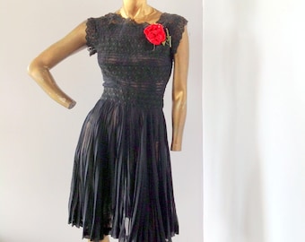 a vintage 1950s glamorous full skirted party dress,black lace and cotton organza, accented with a red rose  SZ med