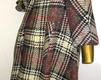 experience the beauty and wonder of this bold vintage 1950s plaid wool coat sz m/L