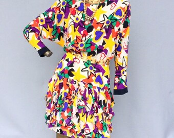 GILLIAN vintage 80s silk short dress, HIgh round neckline strong shoulders,ruffle bottom, batwing long sleve, bold art  print sz s to med