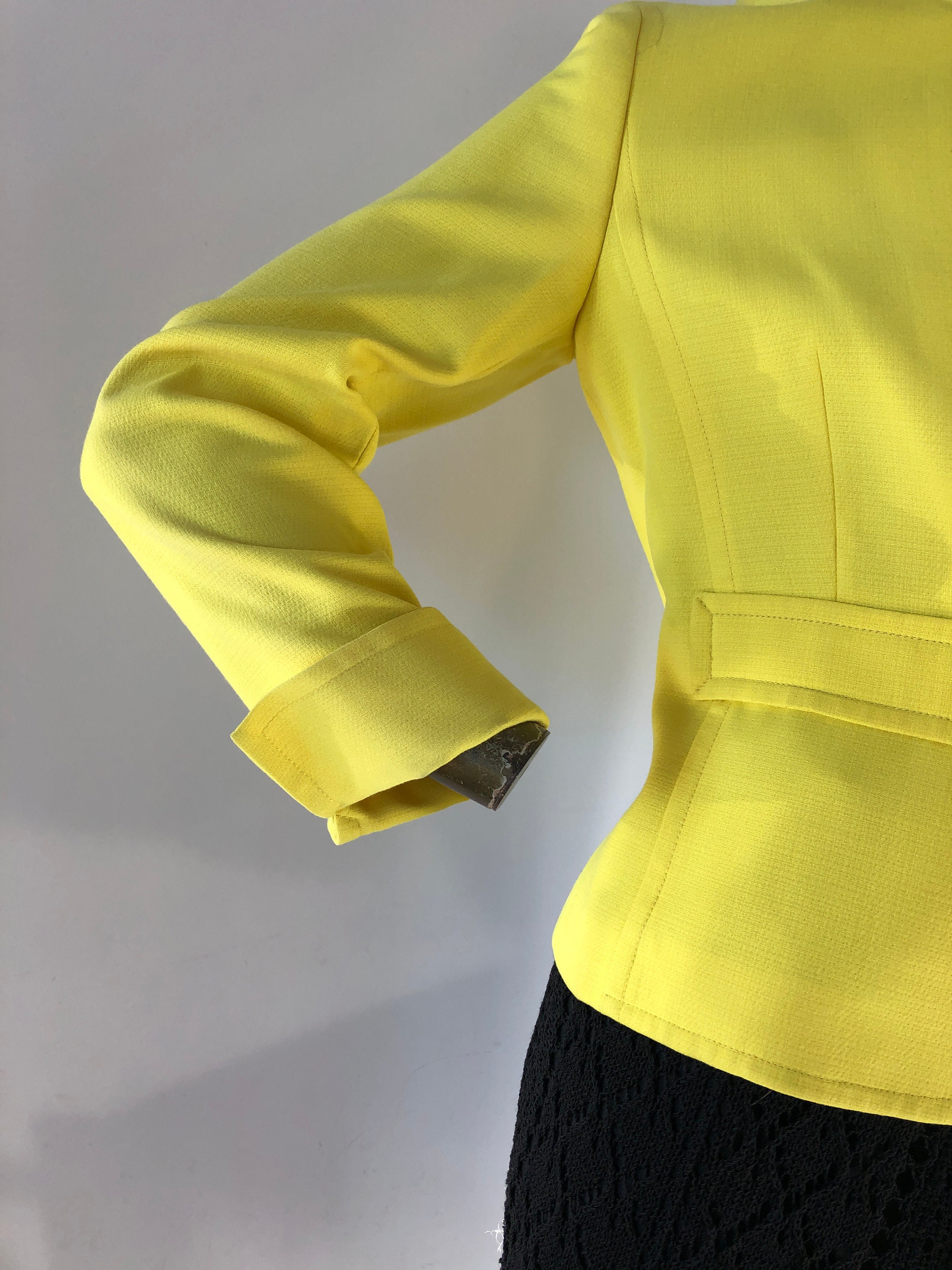 90s Louis Feraud jacket. classic jacket made in a striking yellow wool with  black grosgrain ribbon along the neckline, sleeves, and pockets