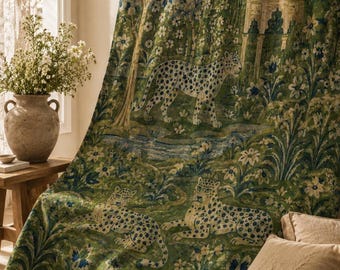 May include: A fabric curtain featuring a detailed tapestry-style print of leopards in a lush green forest setting with blue floral accents and a domed architectural structure. The design includes three spotted leopards amidst trees and flowers.