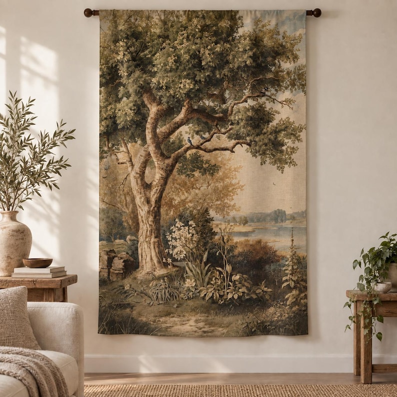 May include: A rectangular wall tapestry featuring a detailed landscape scene with a large central tree, lush green foliage, white flowering plants, and a distant river under a soft sky, all rendered in muted earth tones and shades of green.