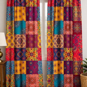 May include: Patchwork-style window curtains in a variety of colors, including red, yellow, teal, and purple. The curtains are divided into squares with intricate patterns. The curtains are hanging on a gold-colored rod above a window.