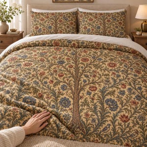 May include: A bedding set featuring a duvet cover and two matching pillowcases with a tan background and a detailed, repeating pattern of a large central tree with sprawling branches, intricate floral motifs, and small birds in blue and red.