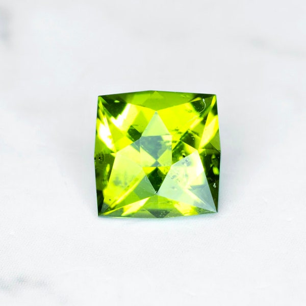 Peridot, Arizona 0.88 Ct Clarity SI2, Apple Lime Green, Square Cut 5.6x5.5 mm, Video on a Hand