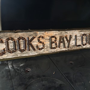 custom sign made with birch bark, twigs, great for indoor or outdoor spaces