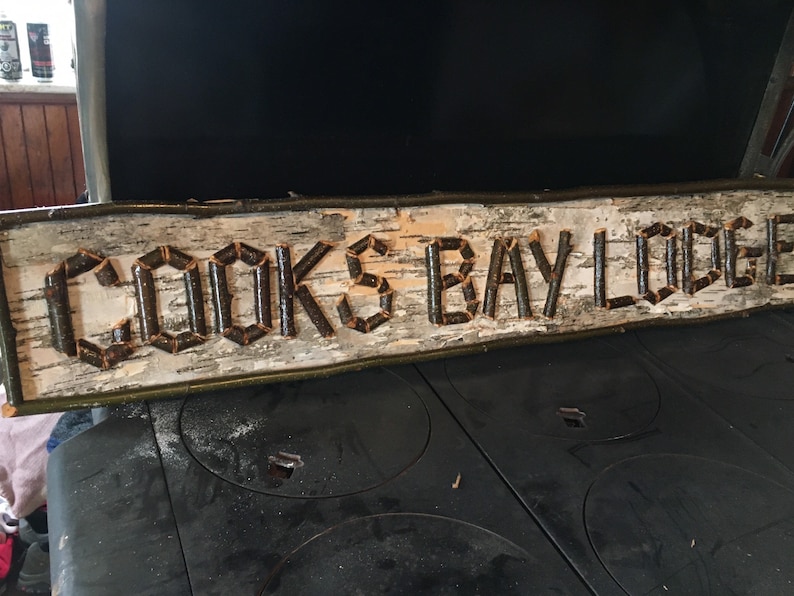 custom sign made with birch bark, twigs, great for indoor or outdoor spaces