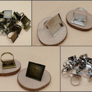 May include: A set of 18 silver and bronze ring blanks with square bezels. The bezels are approximately 1 inch square and have a scalloped edge. The ring blanks are perfect for creating custom jewelry.
