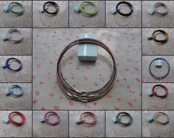May include: A collage of 18 images showing a variety of colors of metal chain necklaces in small gift boxes. The necklaces are all the same style, but in different colors, including red, blue, green, pink, and brown.