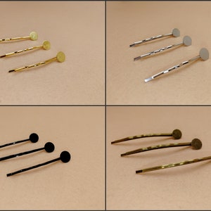 May include: Three sets of hair clips with round metal embellishments. The sets are gold, silver, and black.