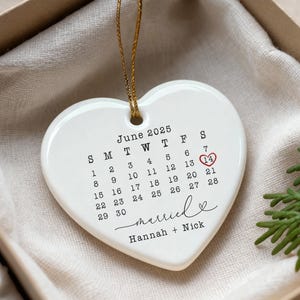 Custom Wedding Date Ornament – Personalized Calendar Gift – First Christmas Married Keepsake – Engagement or Anniversary Gift Red w/ gold string