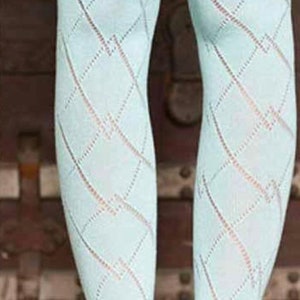 May include: Light blue knee-high socks with a diamond pattern. The socks have a lace trim at the top and small buttons. These socks are a stylish accessory.