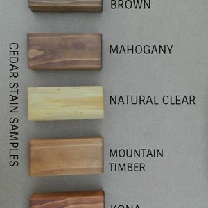 May include: Cedar stain samples in five different colors: Canyon Brown, Mahogany, Natural Clear, Mountain Timber, and Kona.