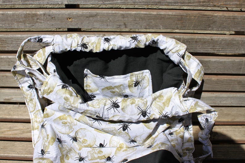 inside pocket a fun accessory for any outfit Spiders and Skulls Drawstring backpack Canvas lined and bottom for durability