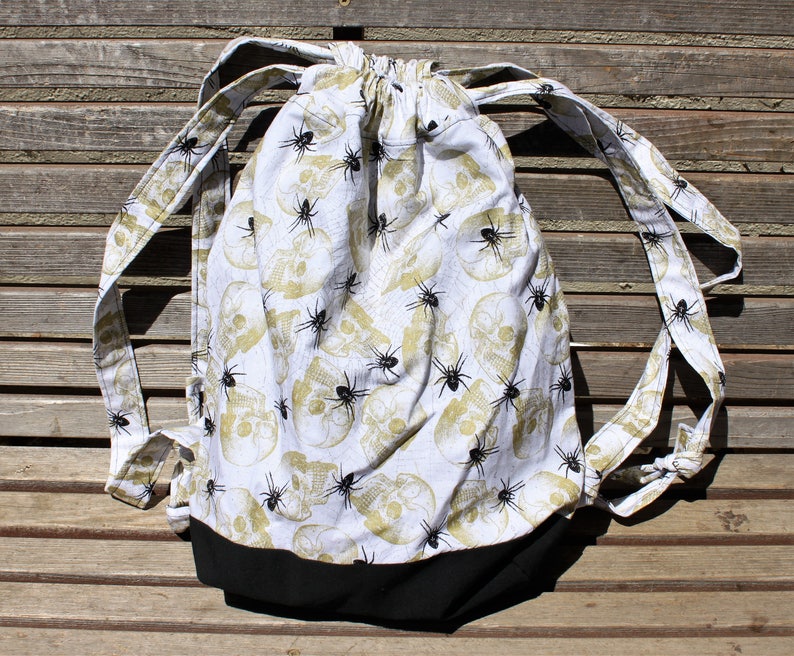 inside pocket a fun accessory for any outfit Spiders and Skulls Drawstring backpack Canvas lined and bottom for durability
