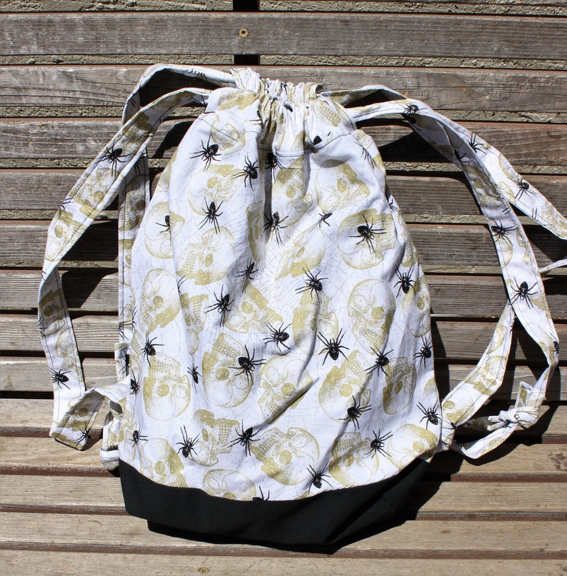 inside pocket a fun accessory for any outfit Spiders and Skulls Drawstring backpack Canvas lined and bottom for durability