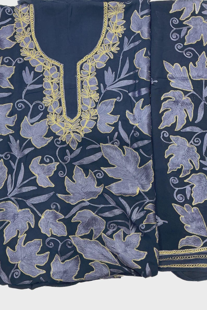 May include: A dark navy blue fabric piece featuring intricate embroidery of light purple leaves with gold-colored outlines. The design includes a U-shaped neckline bordered by gold stitching and a separate vertical panel with matching leaf patterns.