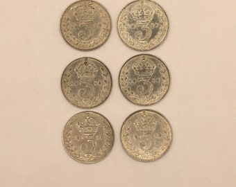 A collection of six silver threepenny bits