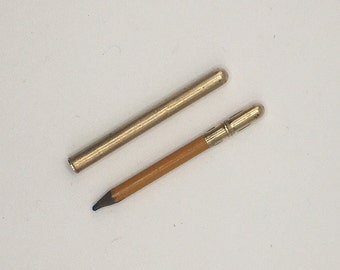 Miniature antique brass pencil holder