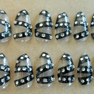 Clear / Black Stiletto false Nails.