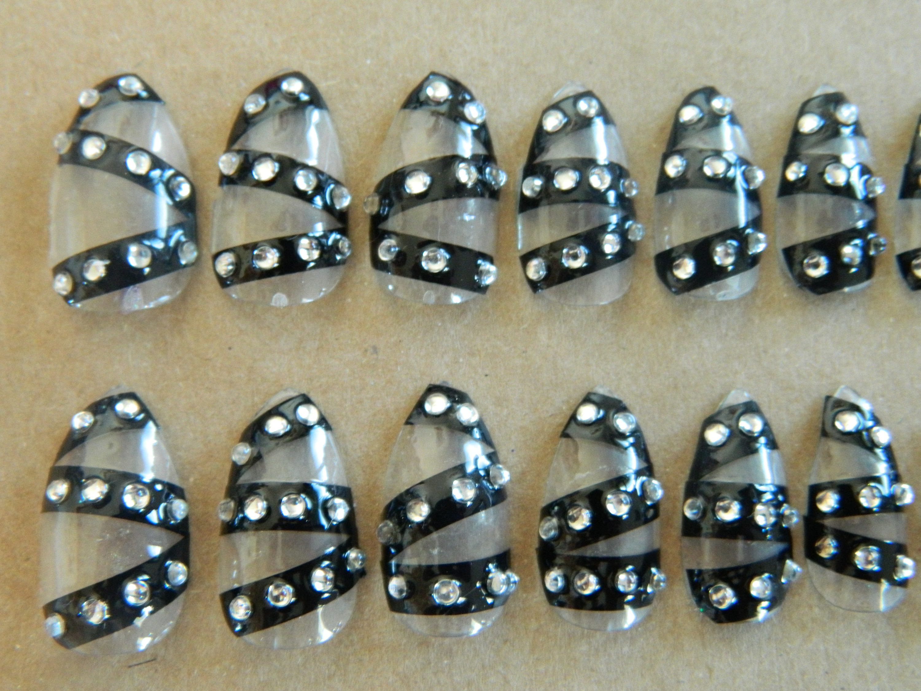 Clear / Black Stiletto false Nails.