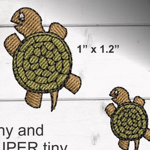May include: Two embroidered turtle designs, one measuring 1 inch by 1.2 inches and the other measuring 0.57 inches by 0.77 inches. Both designs are brown and green and feature a turtle with its head and legs outstretched.
