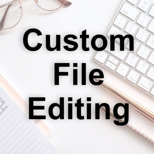May include: A white desktop with a keyboard, a gold pen, and a notebook. The text "Custom File Editing" is written in black bold letters.