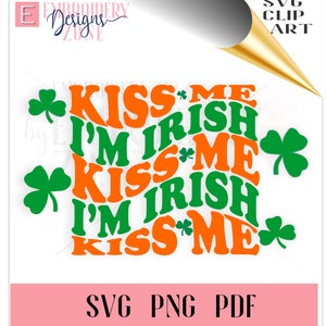 May include: Green and orange text design with the words "Kiss Me I'm Irish" repeated three times. The design is surrounded by four shamrocks.