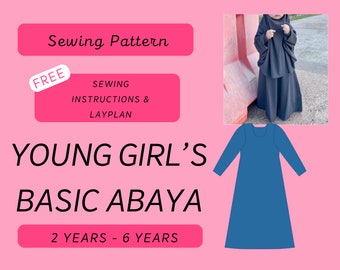 May include: A sewing pattern for a basic abaya for young girls, ages 2 to 6 years. The pattern includes free sewing instructions and a lay plan. The image shows a blue abaya with long sleeves and a round neckline.