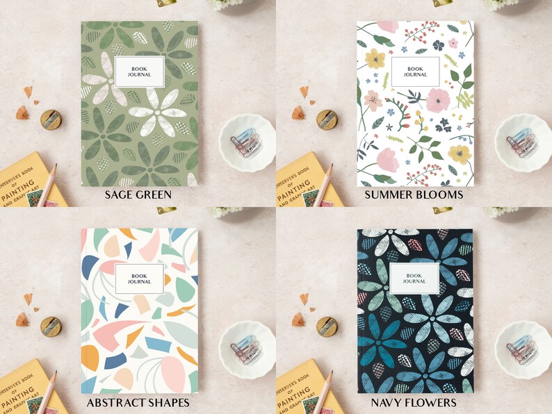 May include: Four journals with various cover designs are shown. The covers display floral and abstract patterns in sage green, summer blooms, abstract shapes, and navy flowers. Each journal has a white label that reads "BOOK JOURNAL".