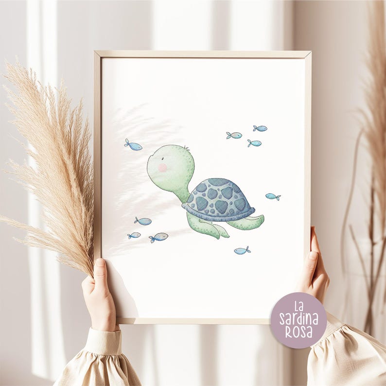 May include: A watercolor illustration of a green sea turtle swimming with blue fish. The turtle has a blue and gray shell and is swimming in a light blue ocean. The illustration is surrounded by a white border.