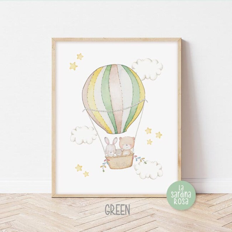 May include: A watercolor illustration of a hot air balloon with a bear and two bunnies inside. The balloon is green, yellow, and pink with white stripes. The background is white with yellow stars and white clouds.