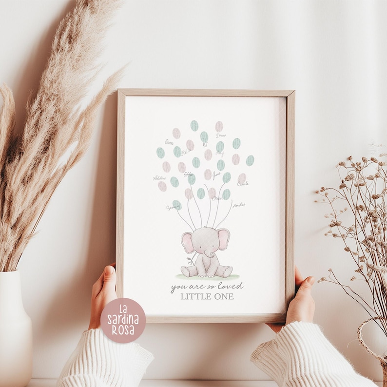 May include: A printable baby shower guest book featuring a pink elephant with green and pink balloons. The text reads "You are so loved Little One".